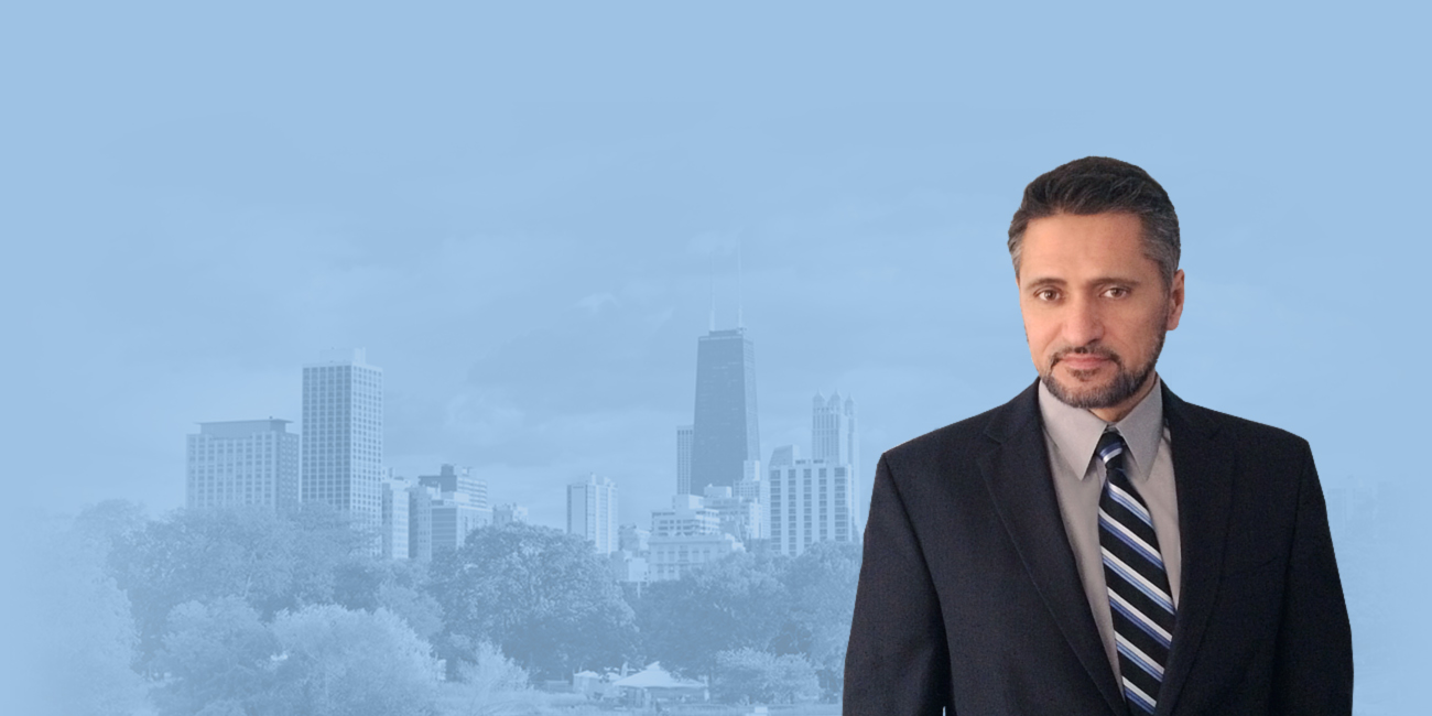 James Kottaras with Chicago skyline in blue-tinted background.