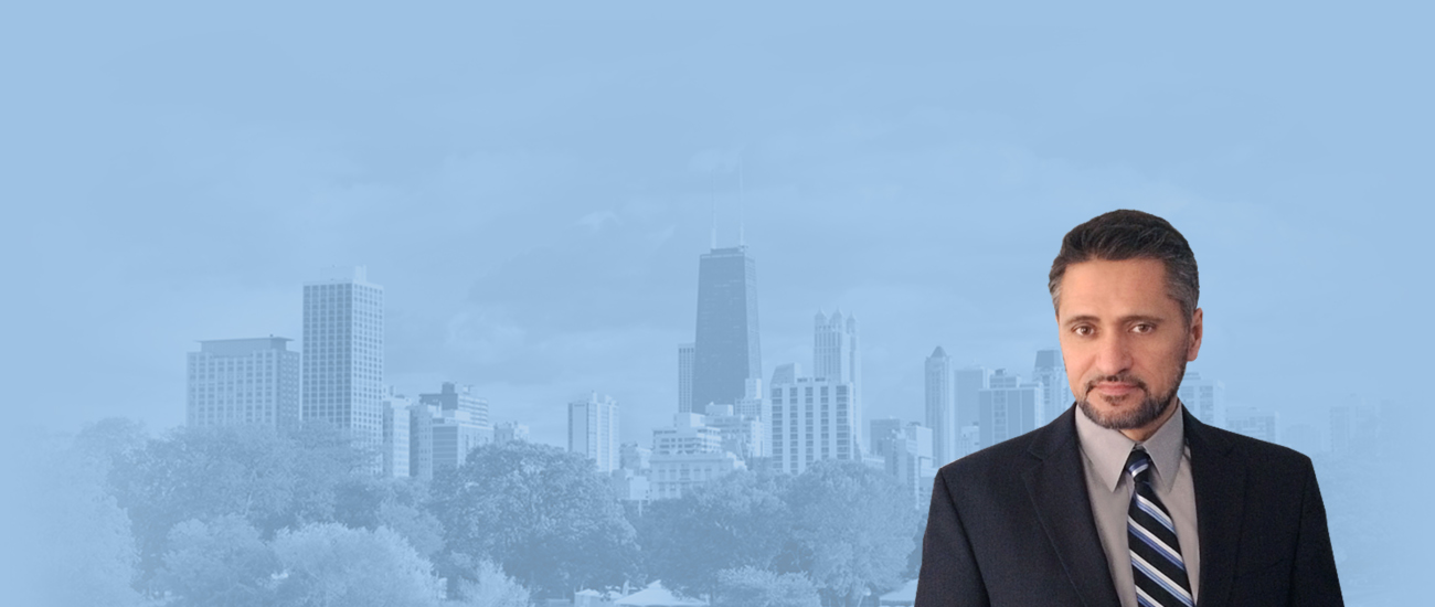 James Kottaras with Chicago skyline in blue-tinted background.